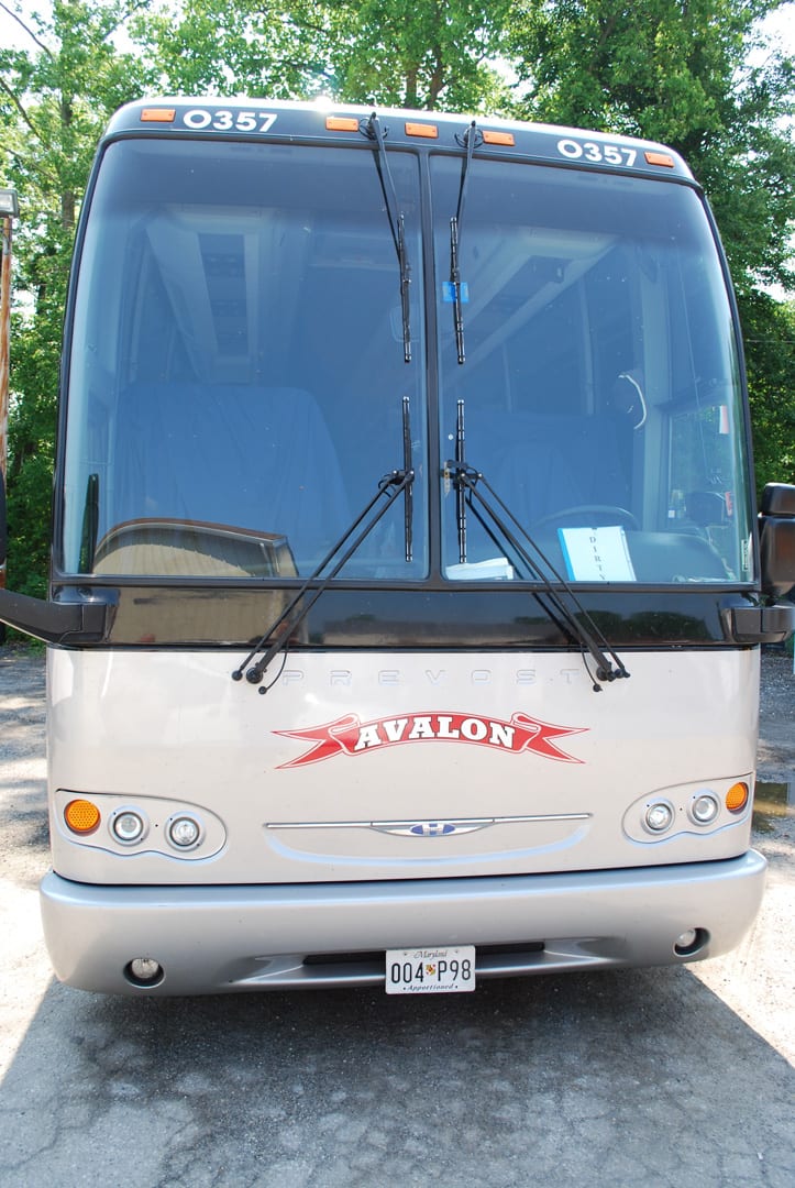 Front view of Avalon Bus with the Logo